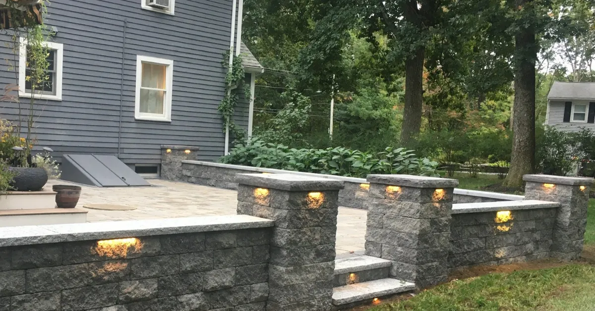 Custom stone patio in Wenham, MA residential yard